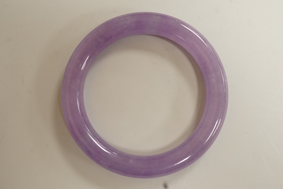 A lavender hardstone bangle, 8cm wide